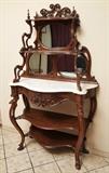 lot 78: Victorian Renaissance Revival Etagere
 with marble top 44" x 18", 74" high late 19th century