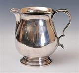 lot 90: Tiffany & Co. Sterling Silver Pitcher
 7" high 30 troy ounces early 20th century