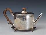 lot 98: George III Sterling Silver Tea Pot
 and matching stand the stand marked Peter and Ann Bateman, 1797 the 6 1/2" pot with obscured maker's mark and dated 1798 21 troy ounces gross