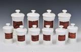 lot 100: Set of 10 Ironstone Apothecary Jars
 9 1/2" and 6 1/2" high late 19th century