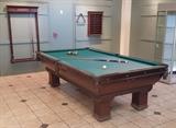 lot 106: Brunswick Mahogany Billiard Table
 "Newport" model with original cue rack and ball rack circa 1900