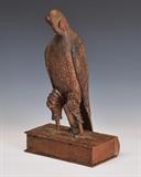 lot 107: The Guthman Eagle
 carved and painted figure of an  American eagle on a book 17" high late 19th century pictured in the American Eagle by Isaacson, page 128, American Primative by Ricco/Maresca, page 222