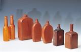lot 113: Group Wooden Bottle and Flask Molds
 seven molds, the largest 9 3/4" high five with WT logo on bottom 19th century
