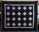 lot 119: Amish Patch Work Quilt
 star pattern 5' 10" x 7' early 20th century