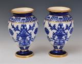 lot 155: William Moorcroft: Pair MacIntyre Vases
 with blue and white decoration 8 1/2" high signed