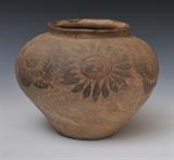lot 201: Mexican Pueblo Pot
 with stylized flowers 12 1/2" diameter, 10" high circa 1900
