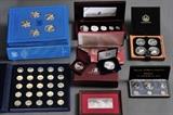 lot 350: Group of Silver Collectible Coins and Medallions
 including Bahama Islands proof set, Panama proof set, 1984 Canadian dollar, 2001 silver eagle, Benjamin Franklin 2013 1 oz silver proof, Signing of Declaration of Independence 1 oz silver, Maple Leaf hologram set, 1972 Olympic set, United Nations (24) and Antique Cars (25)