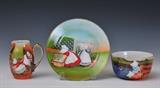 lot 272: Three Royal Bayreuth Children's Dishes
 Sunbonnet Babies pattern including pitcher, bowl and plate