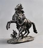 lot 335: after Guillaume Coustou
 bronze group of a Marly horse 22 1/2" high circa 1900