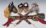 lot 253: Group of Native American Bead Work
 including four pairs of moccasins, including a pair of Plains and Aluet, the largest is 9" long late 19th/early 20th century