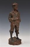 lot 324: Bronze Figure
 Smoking Boy 17" high early 20th century