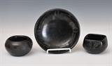 lot 243: Maria Martinez Dish
 black on black decoration 6 1/2" diameter signed Maria & Santana together with two small unsigned Santa Clara pots the large 4" diameter