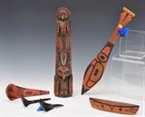 lot 248: North West Coast Artifacts
 including 17" totem, carved oar, paint decorated spoon, boat and two horn spoons early 20th century