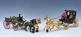 lot 336: Victorian Cast Iron Wagon
 together with a coach with driver and passenger 15" and 13" long early 20th century