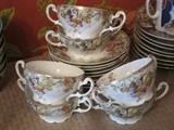 Set of 6 T&V France bouillon cups and saucers