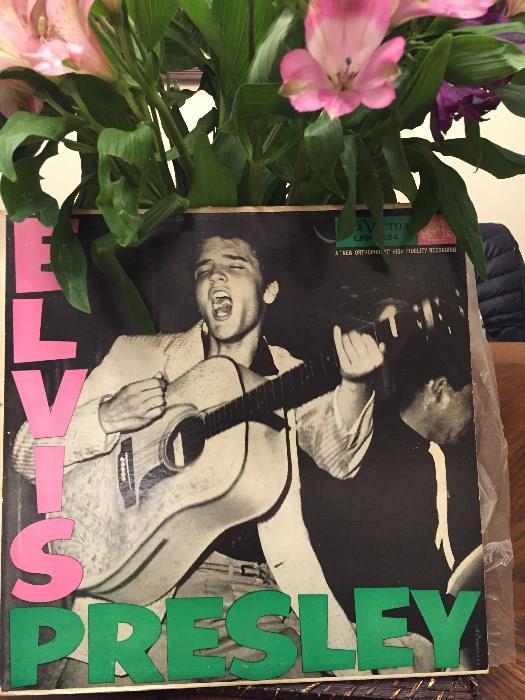 ELVIS FIRST ALBUM. COVER IN GOOD CONDITION. RECORD RATED MINT-. POSSIBLE ORIGINAL PLASTIC SLEEVE.  