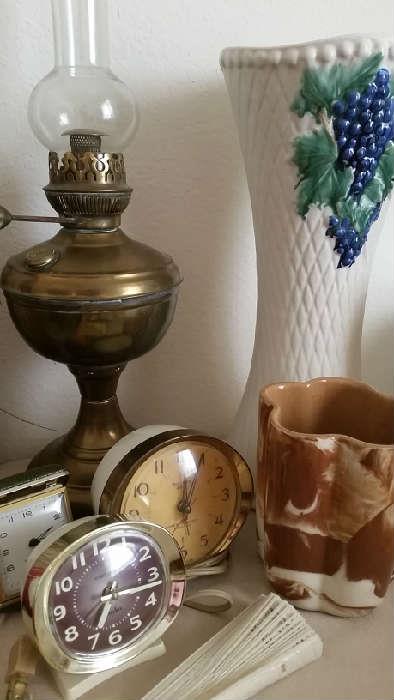 Hull and McCoy pottery, vintage alarm clocks, oil lamp