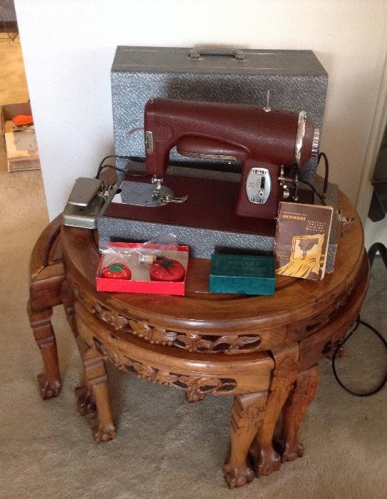 Kenmore electric rotary sewing machine (Model 117-95) with carrying case.  Circa 1948.  It's sitting on 27" round carved Chinese table with 4 nesting tripod stools.  And no need to fight - we have 2 of these tables!