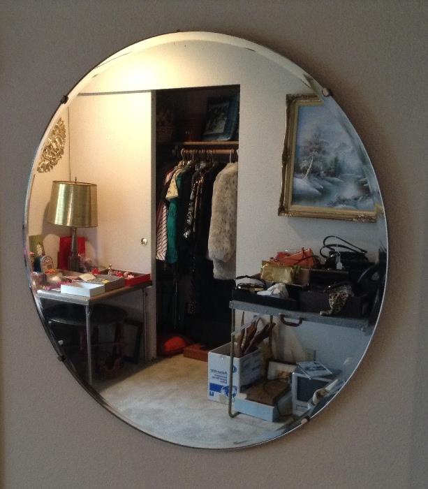 One of two 24" round bevelled edge mirrors.  We also have a 27" round one.