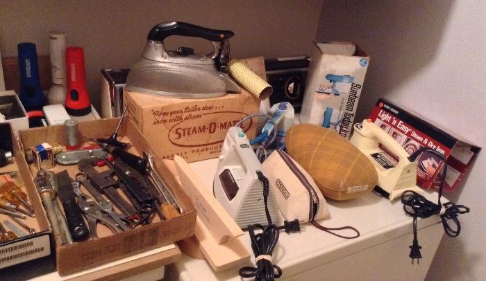 Several irons including vintage Steam-o-Matic with original box, newer Black & Decker irons, a few hand tools