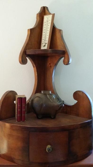 LOVE this corner shelf that is currently not in a corner!  Can be used anywhere!  Do you see the adorable glass piggy bank?