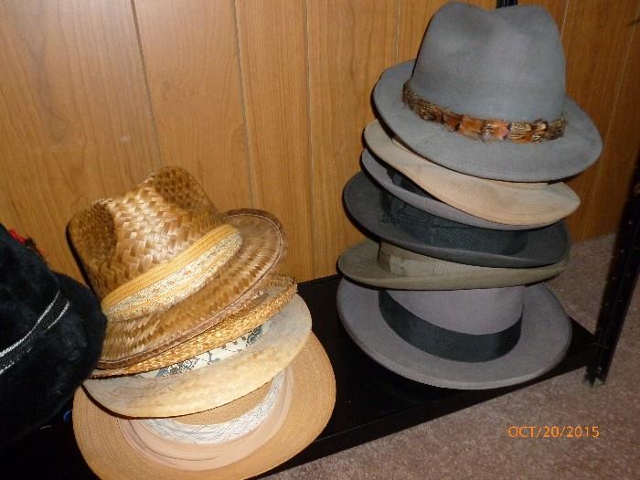 Many vintage assorted men's hats and Fedoras