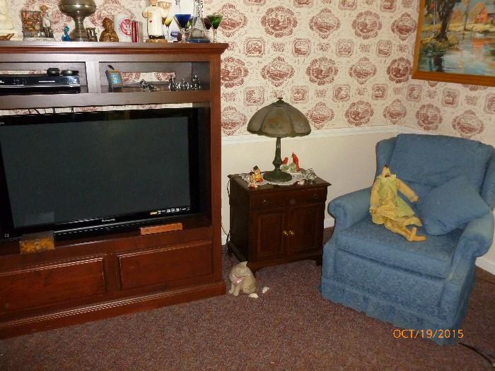 Panasonic TV, TV stand and an antique Renaud lamp
