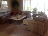 Sectional leather sofa, two easy chairs, ottoman, coffee table