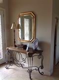 Wrought iron foyer table, large gold mirror