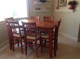 Bistro table has slide out, pop up extension. Six chairs