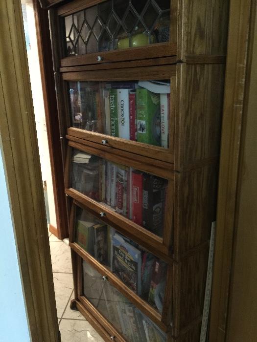 antique glass/leaded glass front lawyers cabinets - great cook book collection 