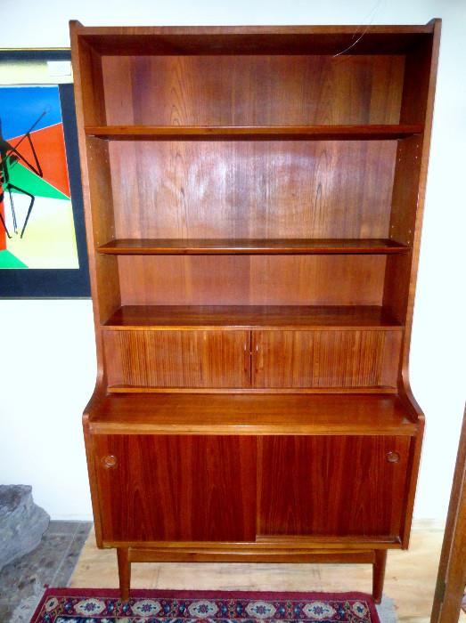 Bornholm Mobler Danish Modern Teak Secretary/Bookcase, C. 1960, with slide out writing surface and tambours, stenciled on its back "BM Made in Denmark".