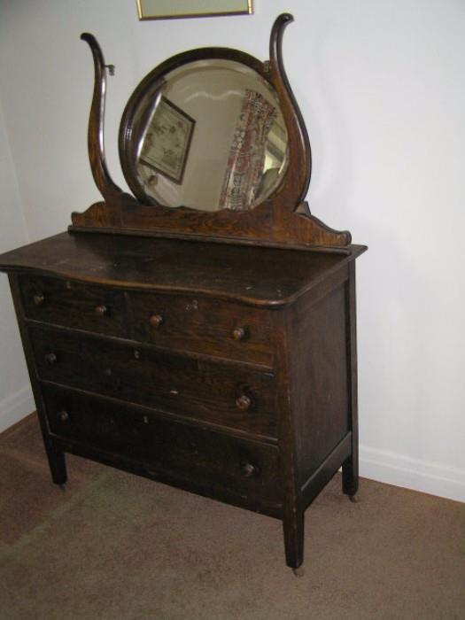 Odd ball dresser w/mirror rack; oval mirror doesn't fit