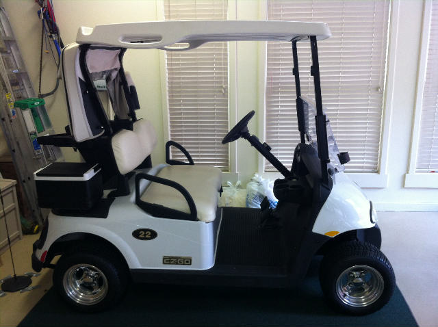 2009 E-Z-Go golf cart (48 volt batt., mag wheels, fold-down windshield, signals, lights, ball/club cleaner)