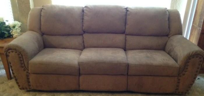 Dual reclining sofa with nail head trim