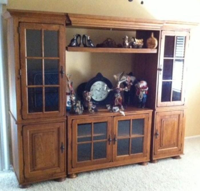5-piece media center/wall unit. 2 bookcases, small media center in the lower bottom, top arch with light and adjustable middle shelf. 