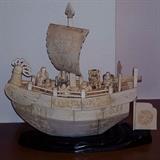 Vintage carved bone paneled ship with rooster prow and Immortals passengers