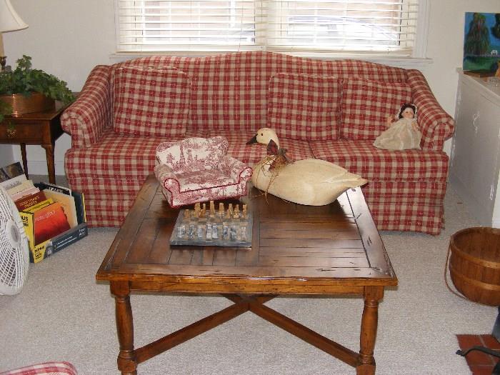 Red Plaid Sofa and Wood Plank Coffee Table