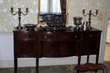 Sheraton bow-front sideboard loaded with old silver plate