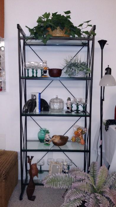 Wonderful heavy shelf with quarter inch rounded edge glass shelves which are held in place with clear plastic suction cups 