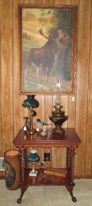 Antique walnut table, candlestick phone/lamp, kerosene lamp, original oil painting of moose