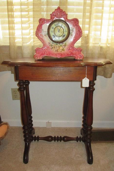 Gilbert porcelain clock, antique table