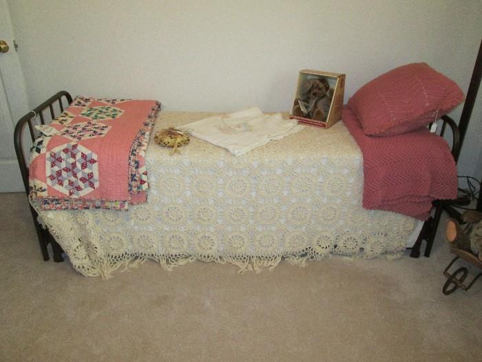 Iron day bed, crocheted bedspread