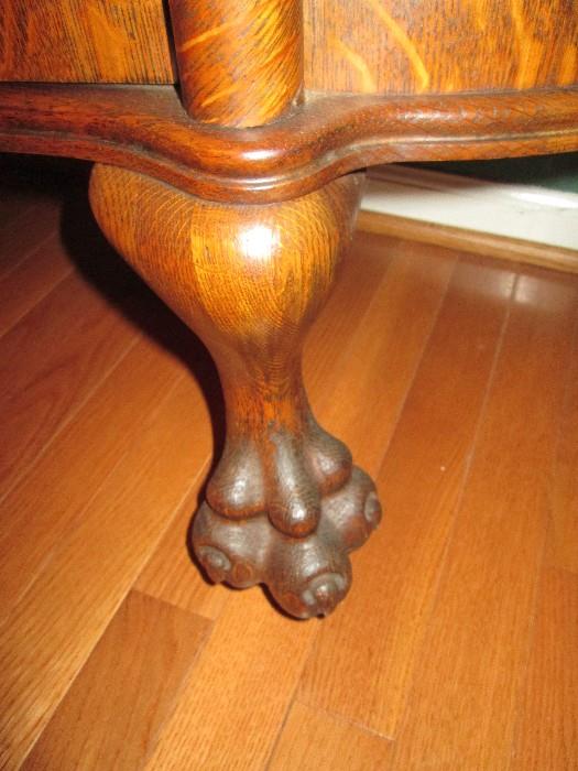 Paw feet of oak china cabinet