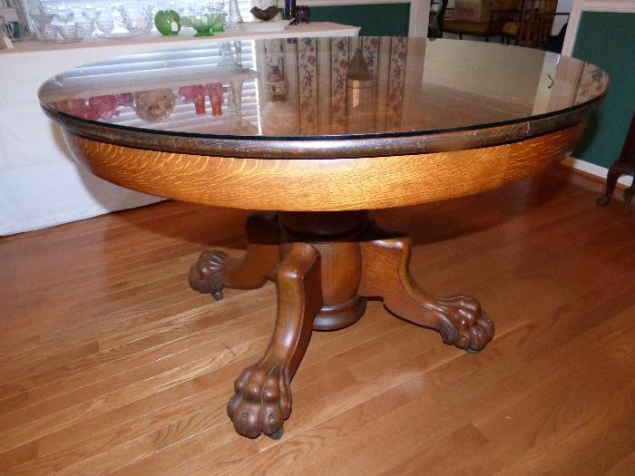 Gorgeous tiger oak round dining table with "hairy paw" feet