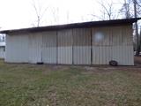 Horse barn behind shop building
