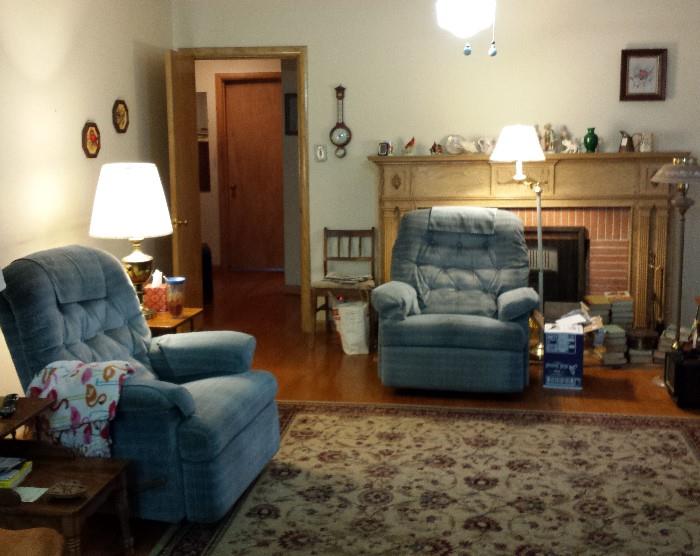 matching recliners, floor lamps, rug, end tables