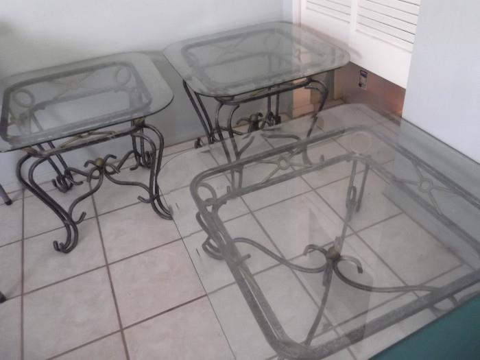 2 glass end tables and 1 glass coffee table. 