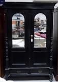 Antique oak wardrobe with mirrored doors.