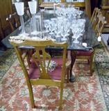 Glass top dining table w/claw foot Chippendale mahogany base.  Chairs are straight leg Chippendale with original needlepoint seats.  Large set of glasses on top are classic Duncan Miller stems (3 part mold)